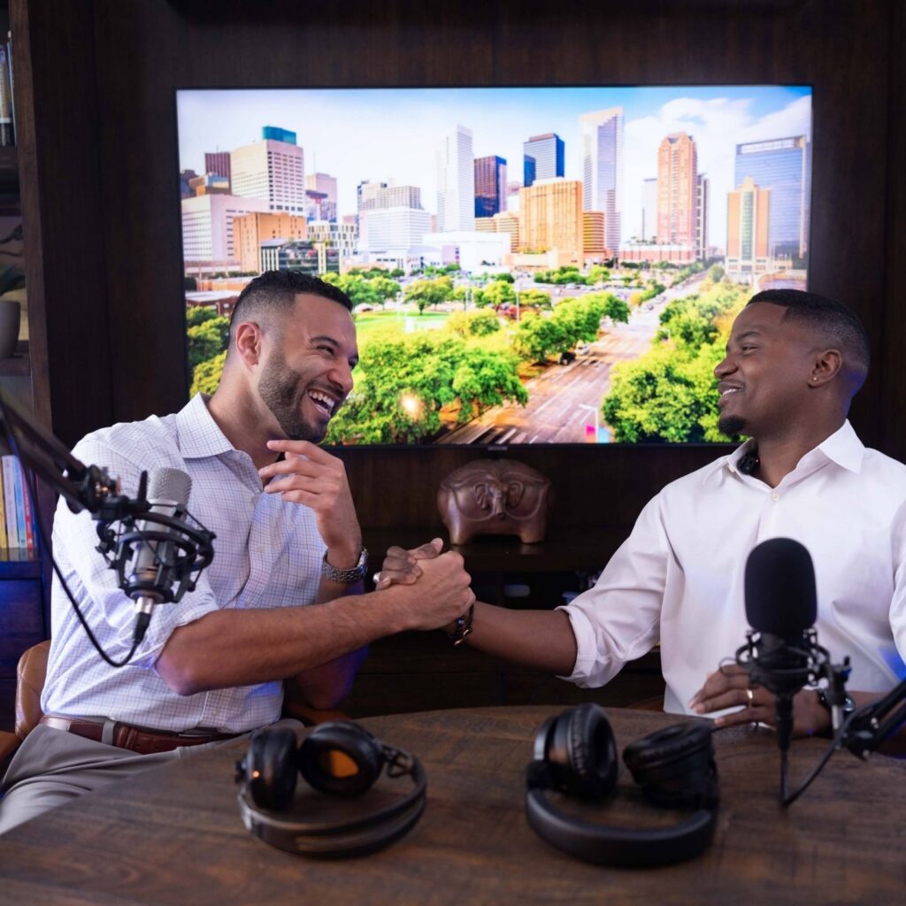Coach John Marshall and former cohost Tony Holmes, celebrating with a handshake prior to recording an episode of The Present Professional Podcast.